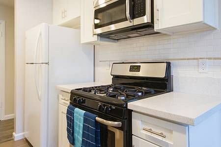 Kitchen has stove, oven and microwave