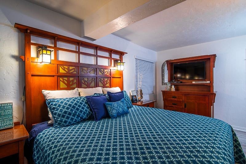 KIng bed and credenza with smart TV