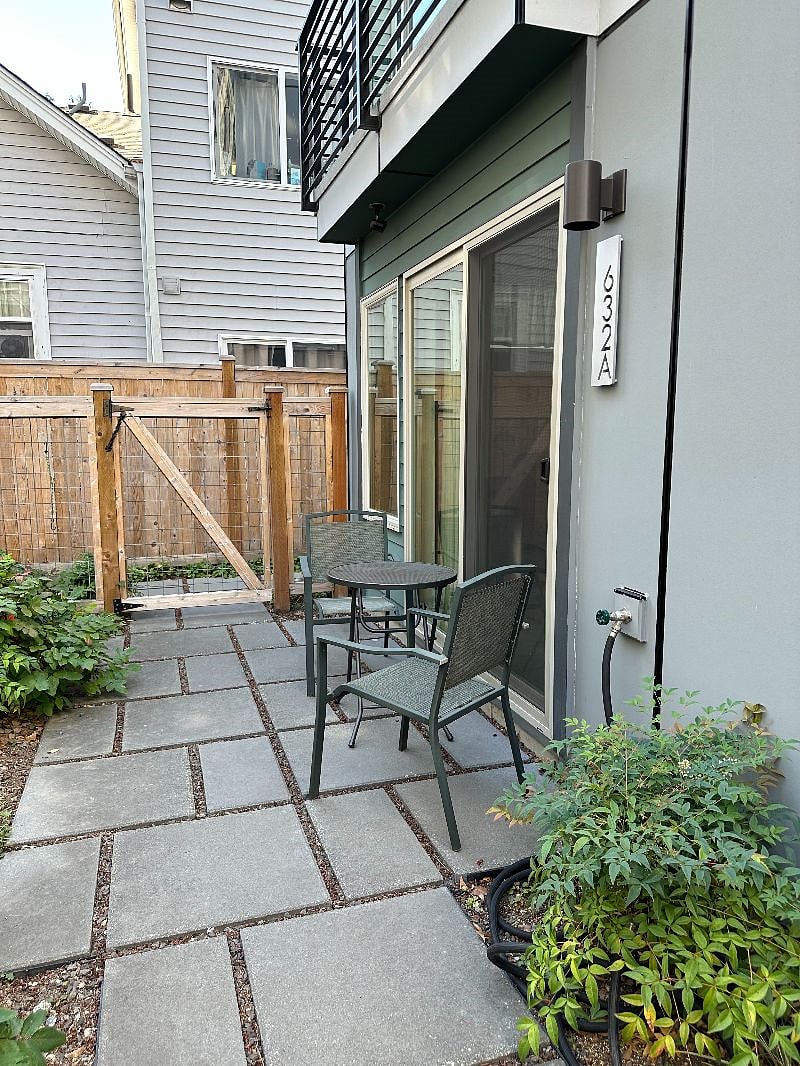 Sliding glass doors in the room lead to a patio and garden