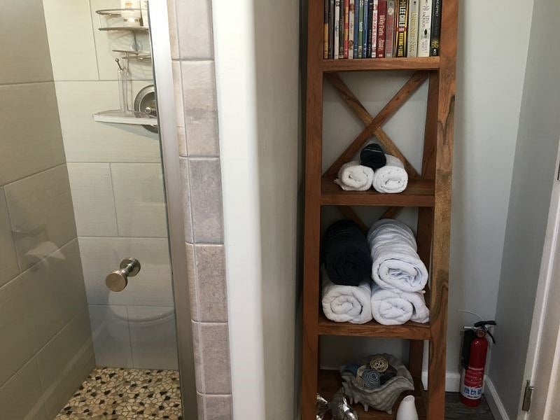 Modern shower. Beach chairs/umbrella provided.