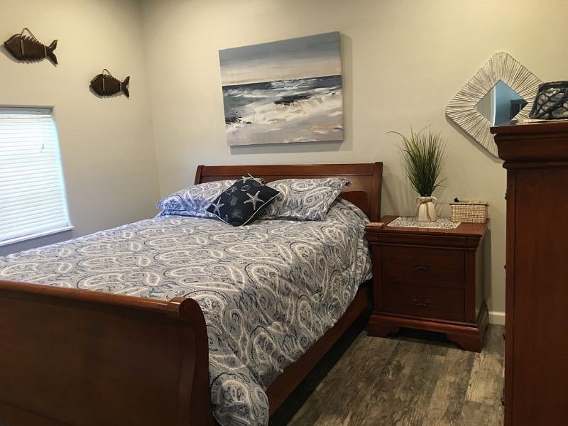 Bedroom with blackout curtains and locking door.