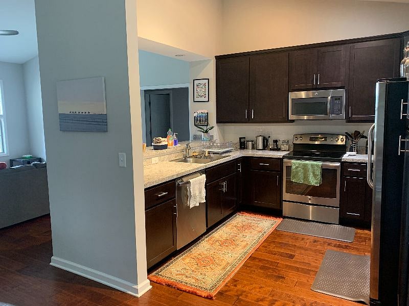 Kitchen. The open door you see is for the shared bathroom. The available bedroom is to the right of the bathroom.