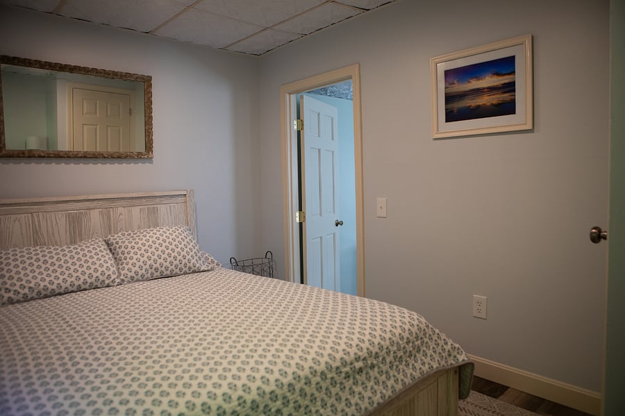 The bedroom has a queen sized bed