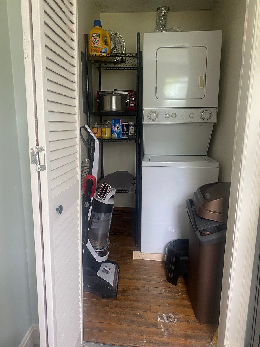 The kitchen pantry has a washer/dryer combo and storage space