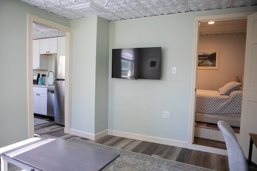 The living room is next to the kitchen and the bedroom is off the living room. The bathroom is in the bedroom.