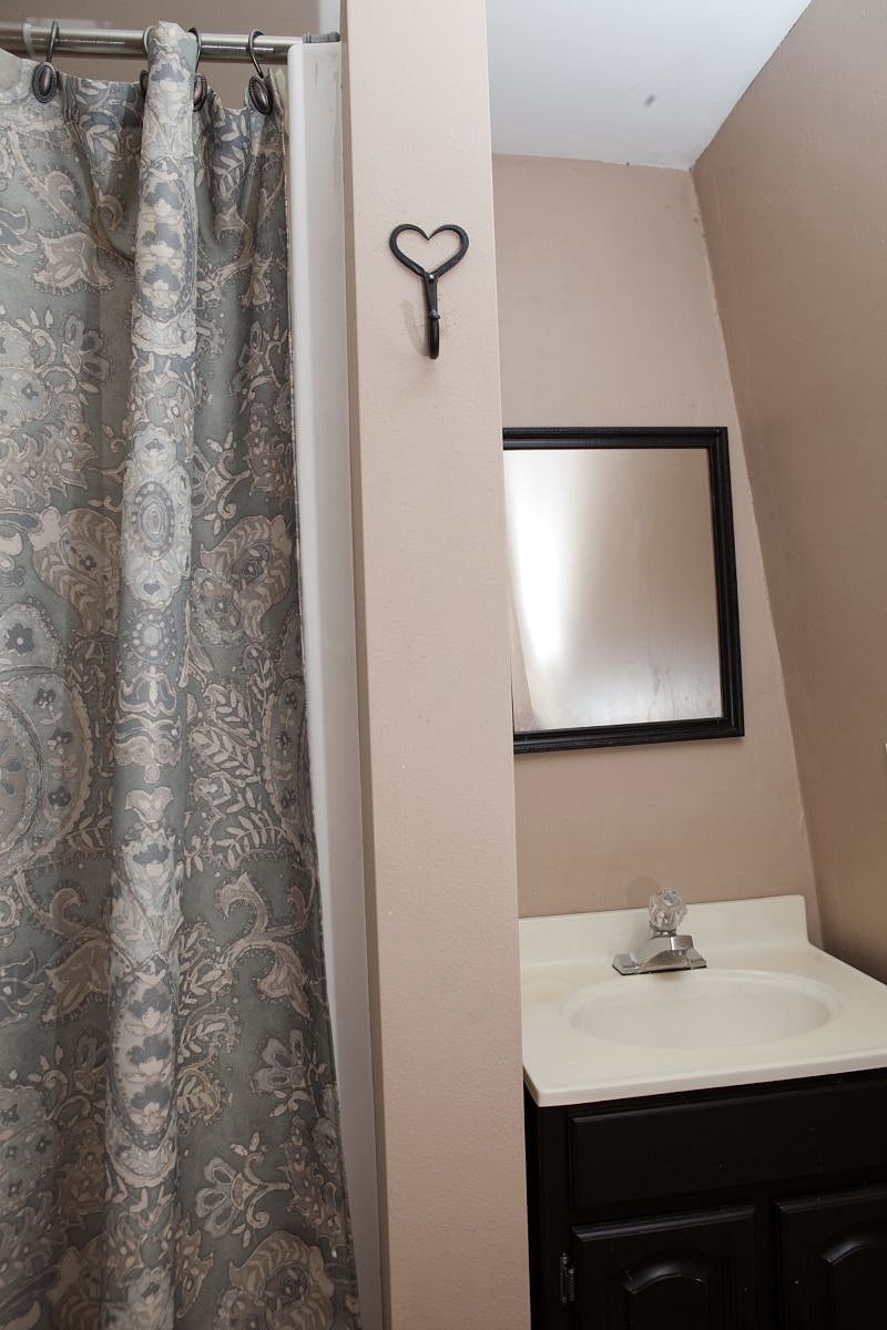 this bathroom has a shower stall.