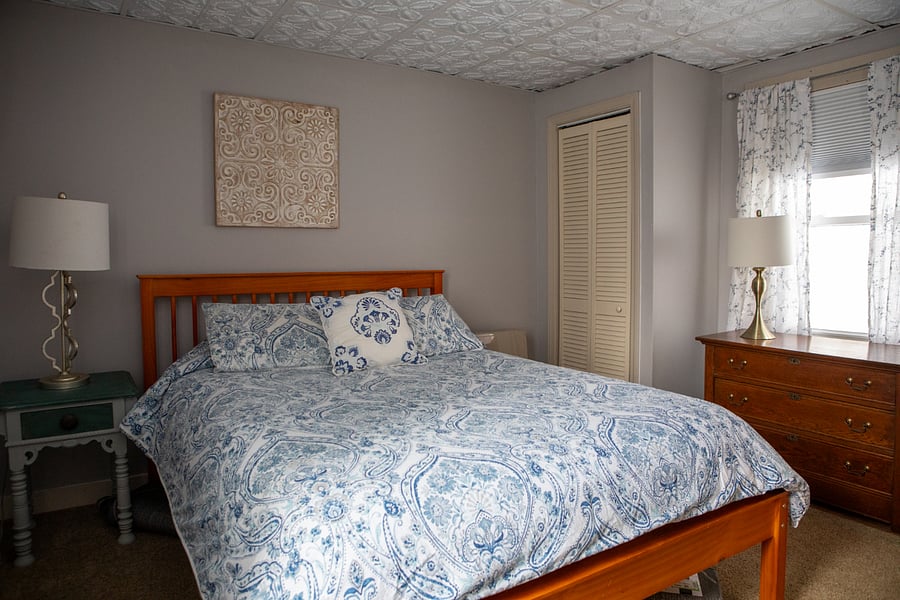 This is the bigger bedroom and has a queen sized bed.