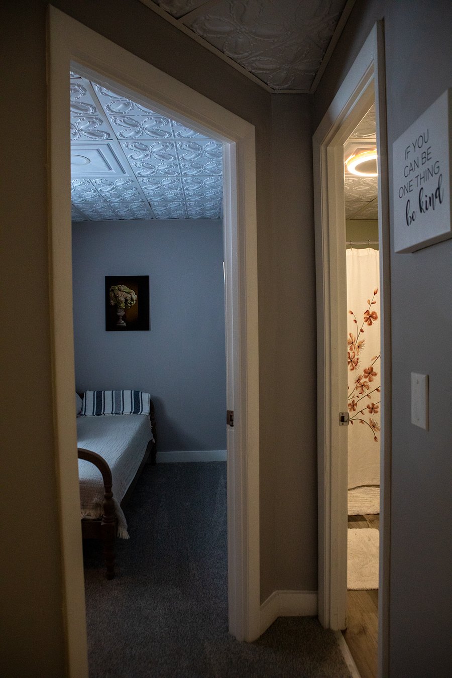 This is the view of the small bedroom and bathroom from the hall.