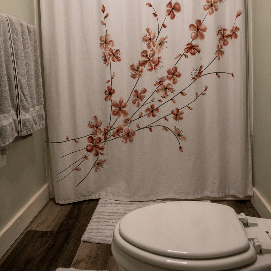 The bathroom has a tub and shower and has new flooring and paint and has a light with a Bluetooth speaker so you can listen to music/podcasts while you get ready.