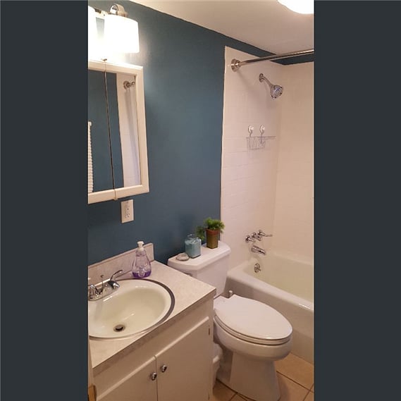Comfortable bathroom with a view of the rear patio.