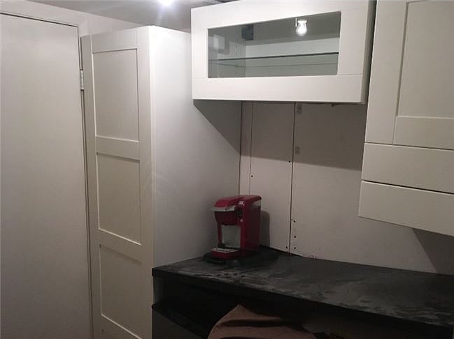 walk thru closet with wet bar 