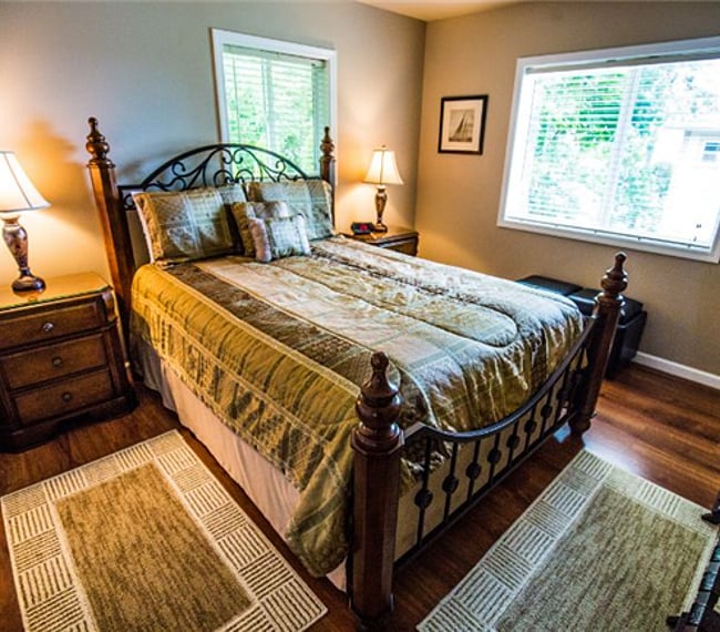 Zoom lens photo of bedroom. Queen bed.