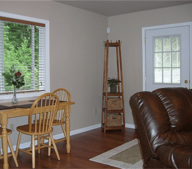 View of front door with coat/hat rack