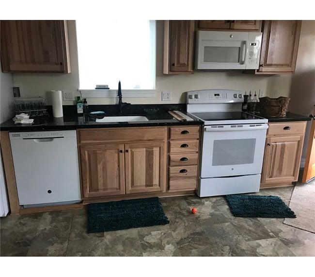 beautiful cabinets, full sized oven and stove