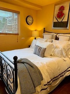 bedroom has nice linens and pillows.  night stands have usb chargers built in.  room has a full size closet.
