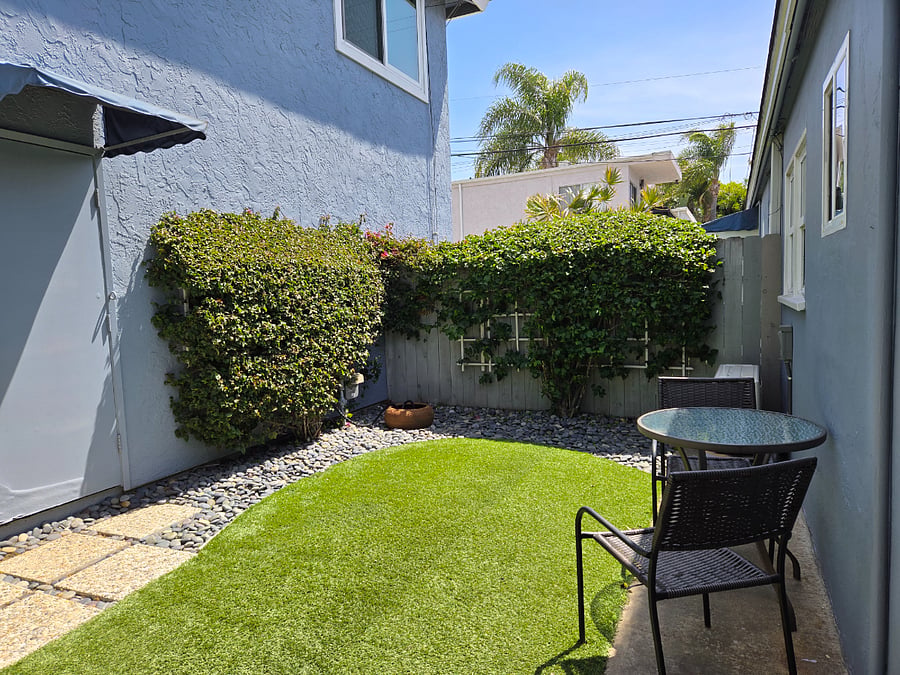 Your private backyard with bistro table and two chairs.