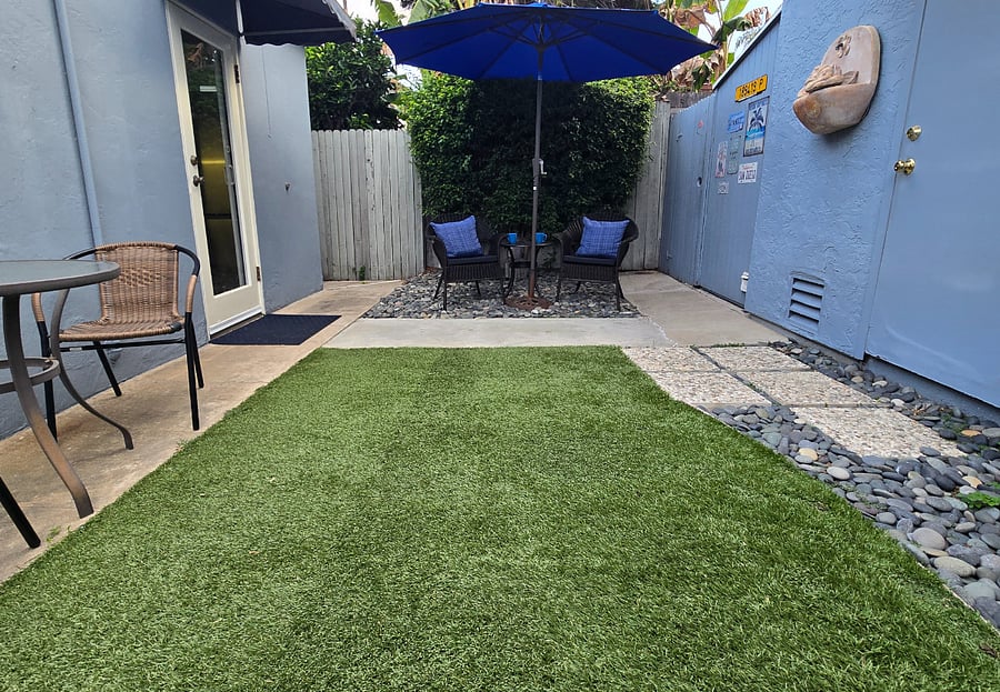 Your private backyard with sitting area under the big umbrella.