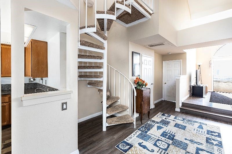 Spiral stairs lead to 2nd bedroom