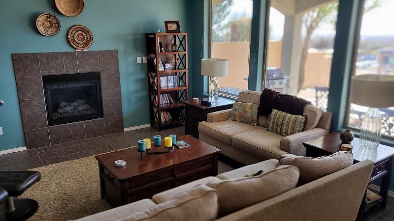 Bright livingroom with gas fireplace and lovely sunsets.