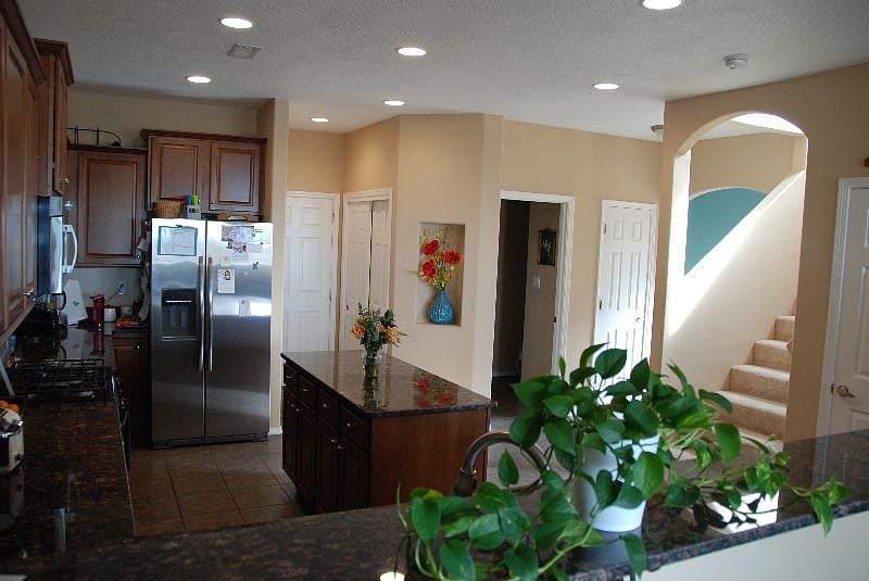 Kitchen with a nearby  guest bathroom.
