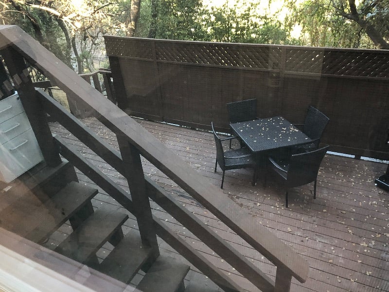 View from living room window unto deck