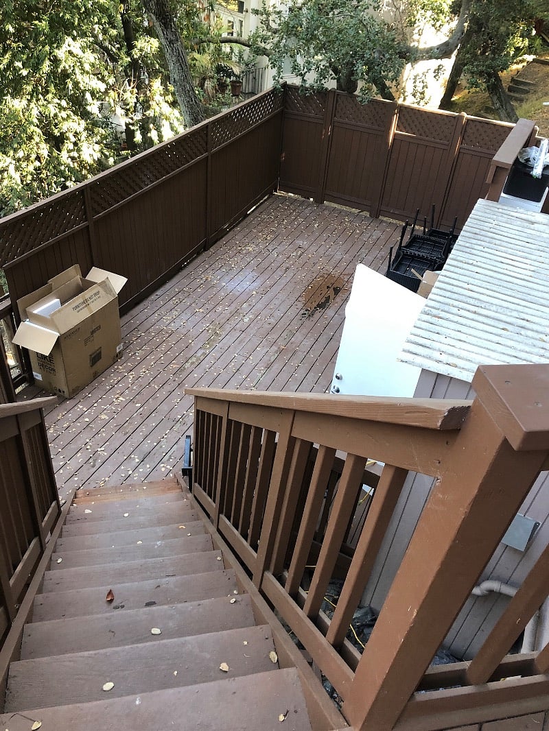 Staircase # 2 down to private deck & laundry room & Front door entrance into the unit