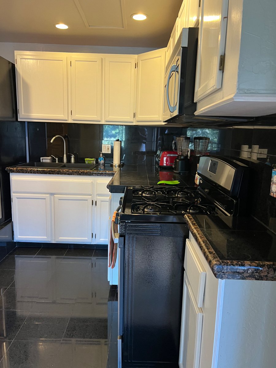 Kitchen with gas stove & burners and built in microwave