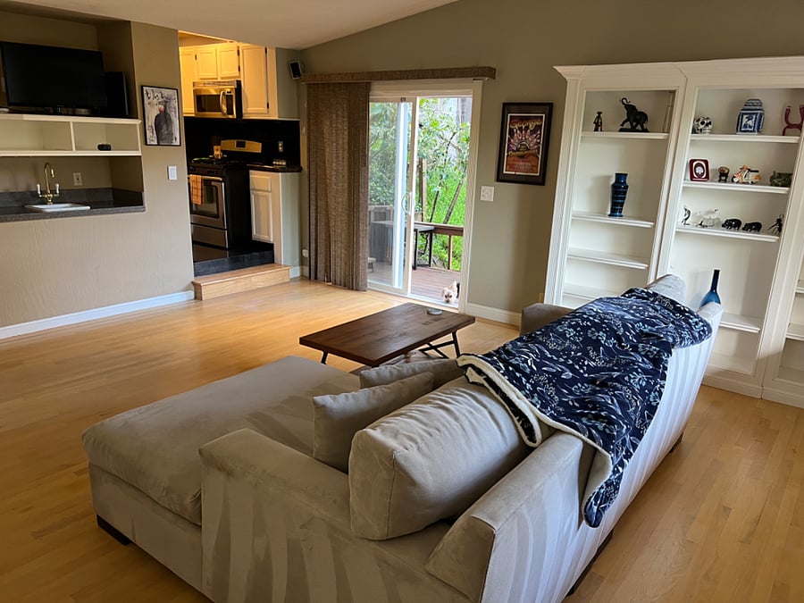 Living room with large built in bookcase & wet bar & TV cabinet with brand new 43" smart TV