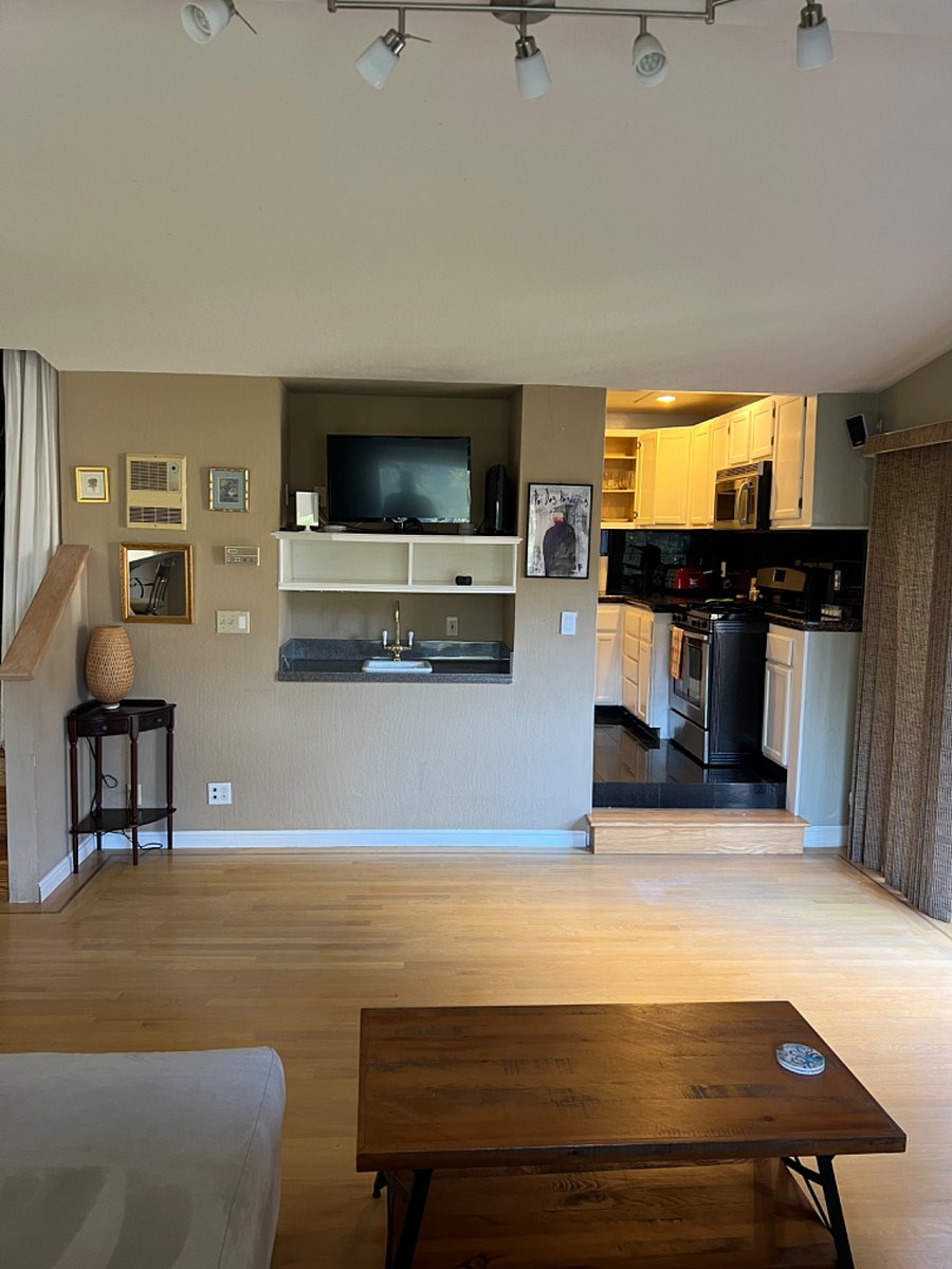 View from couch to the TV & wet bar
