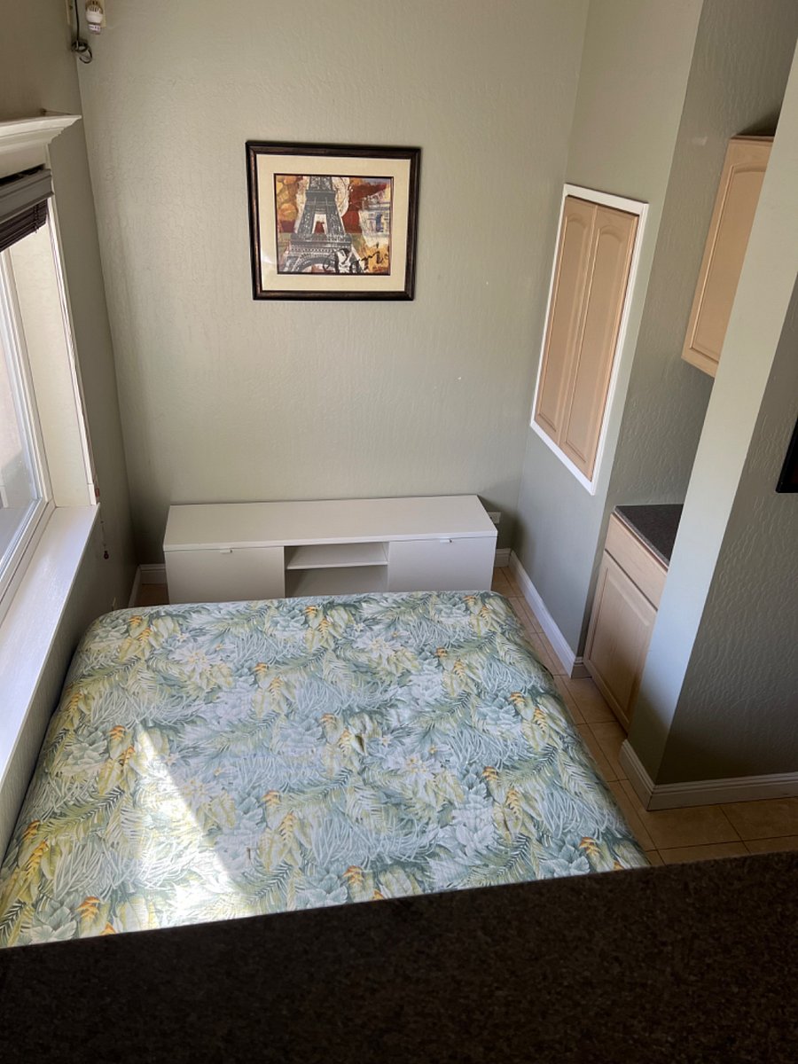 View of bedroom from the breakfast bar...Lots of cabinet storage