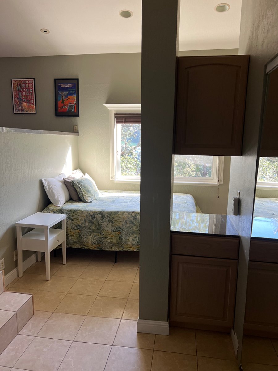 View of bedroom area from closet sitting area