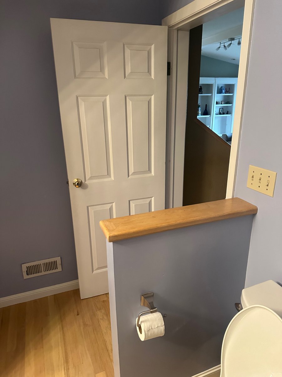Inside bathroom looking out to living room
