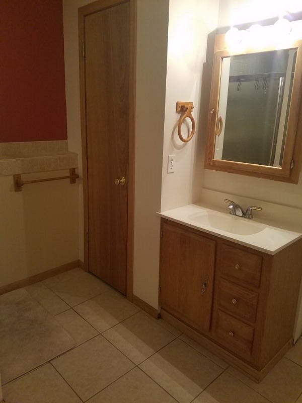 Bathroom sink area outside of the large shower