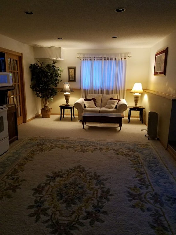 Living room and kitchen with nice open floorplan and relaxing lighting options
