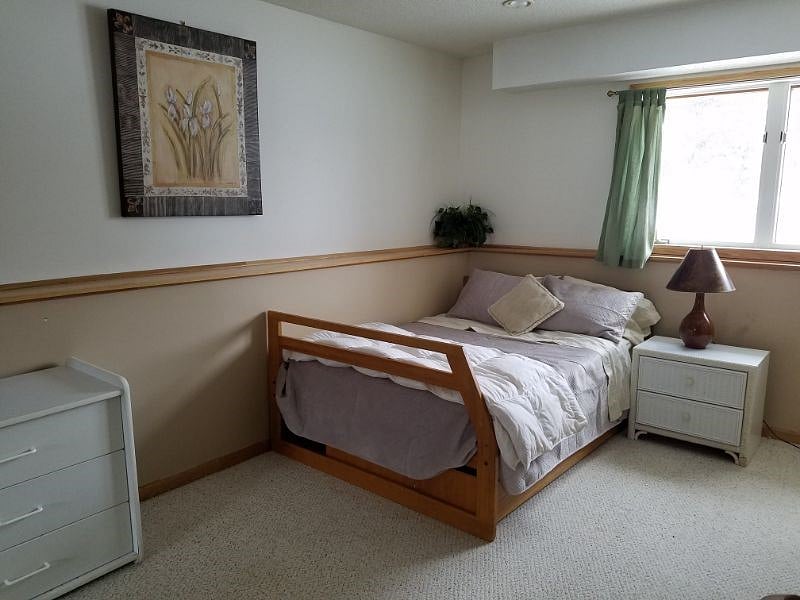 North facing bedroom with the curtains open Room is 11x14