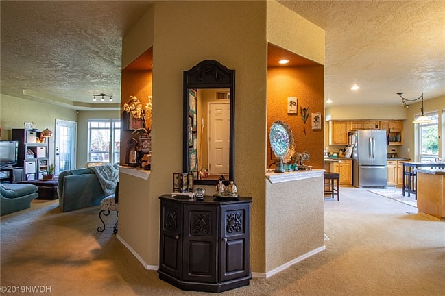 As you enter, the family room is on the left, formal dining room on the right