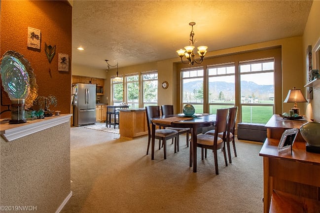 The formal dining room looks out on the Coburg Hills