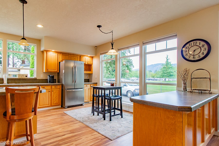 The kitchen nook is a wonderful place to enjoy your morning coffee, or sit at your computer while enjoying this wonderful view every season of the year.