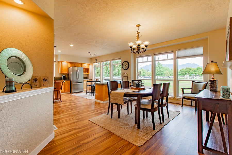 Open and expansive view of the dining room, nook and a portions of kitchen area.