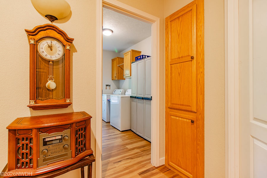This shared laundry room is off the main hallway of Suite 1 and right outside the double locking door to Suite 2.