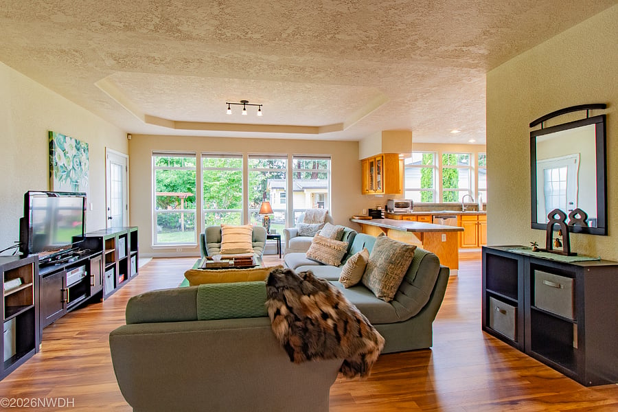 Light and bright living/family room looks out on fully landscaped backyard.