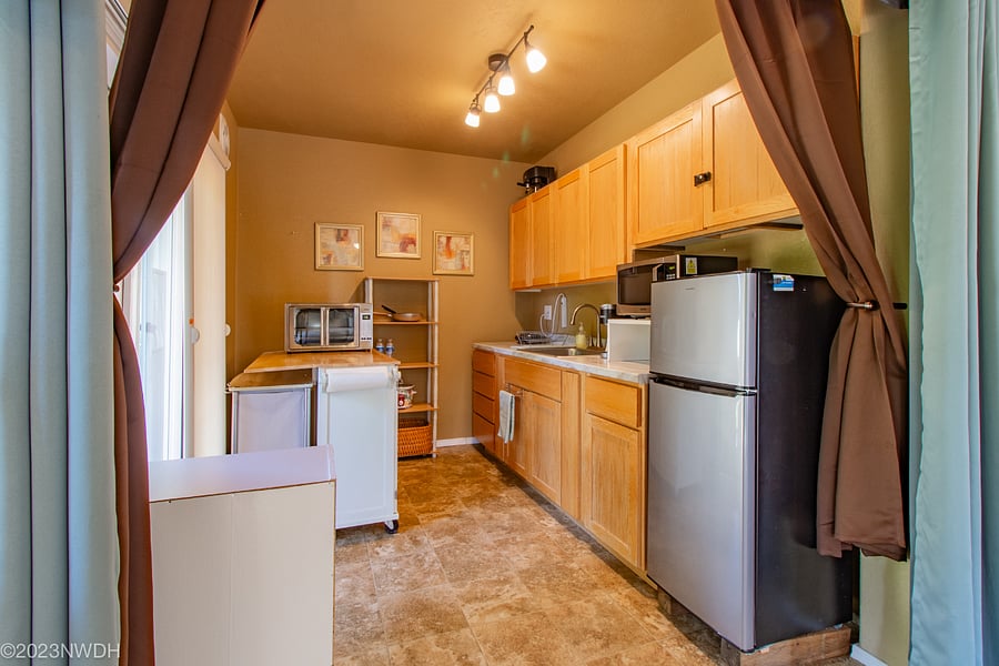 Kitchenette includes countertop convection oven, hot plate, microwave and coffee maker