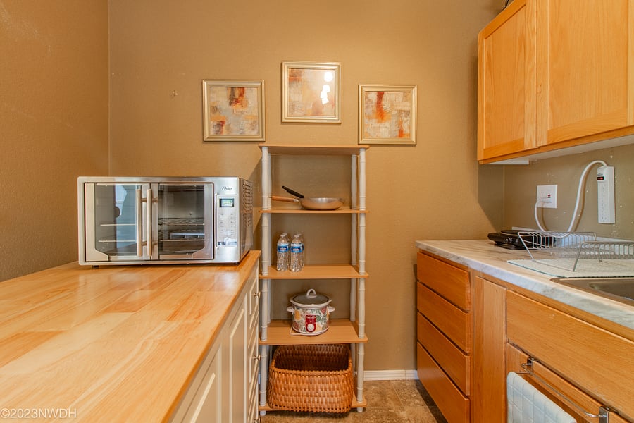 Kitchenette is fully equipped with dishware, silverware, bowls, pans, etc