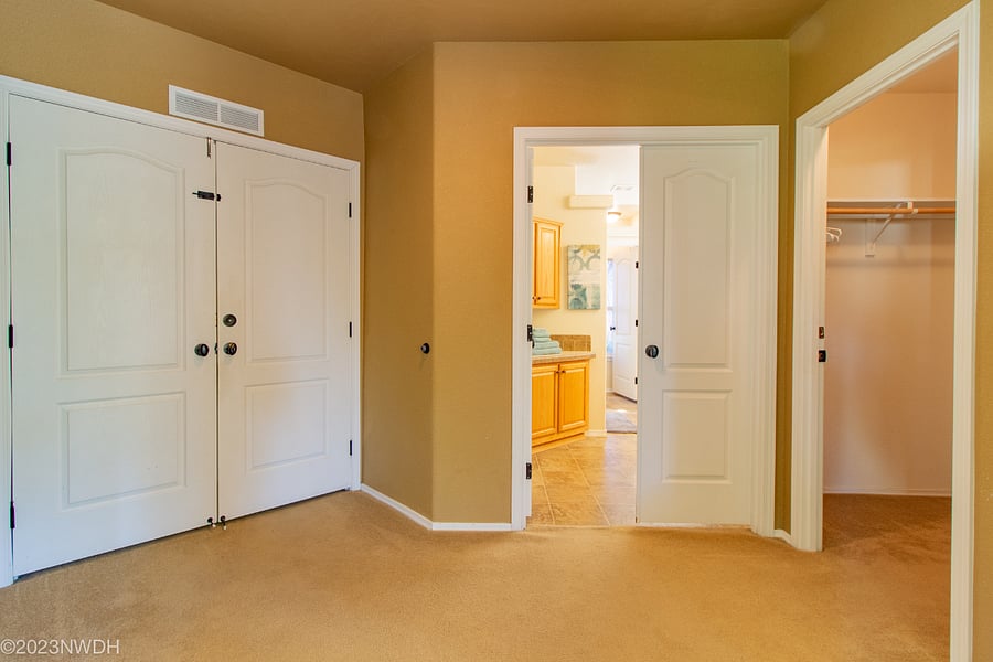 Double doors leading into hallway to laundry room