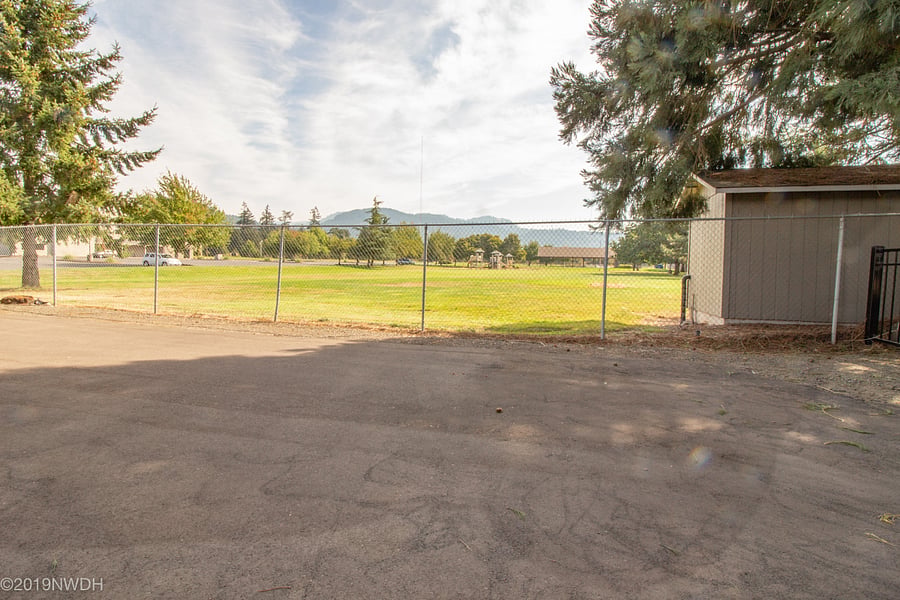 Security fencing is installed along eastern length of property. Church greenbelt and Coburg Hills are directly east