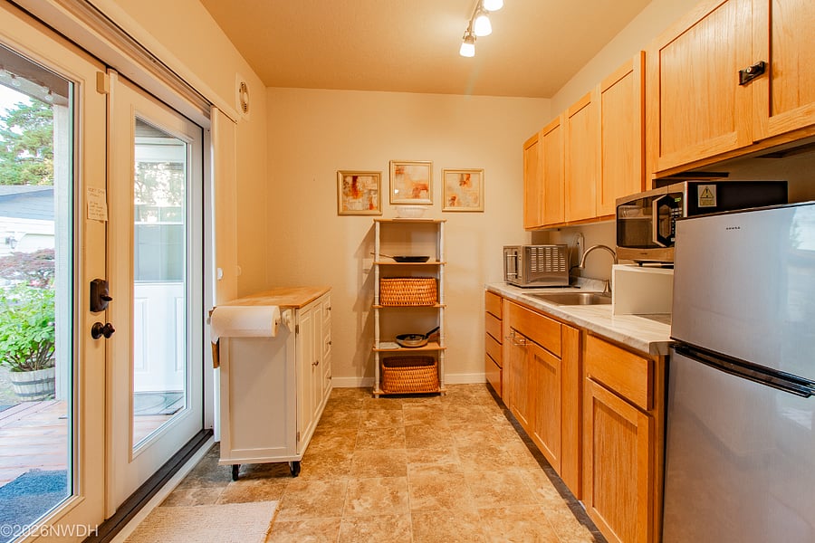 Kitchenette includes countertop convection oven, hot plate, microwave and coffee maker