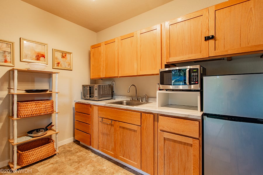 Kitchenette is fully equipped with dishware, silverware, bowls, pans, etc