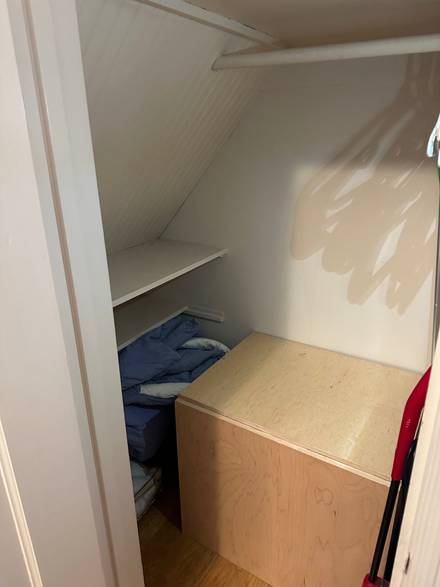 The kitchenette includes a small closet for more storage