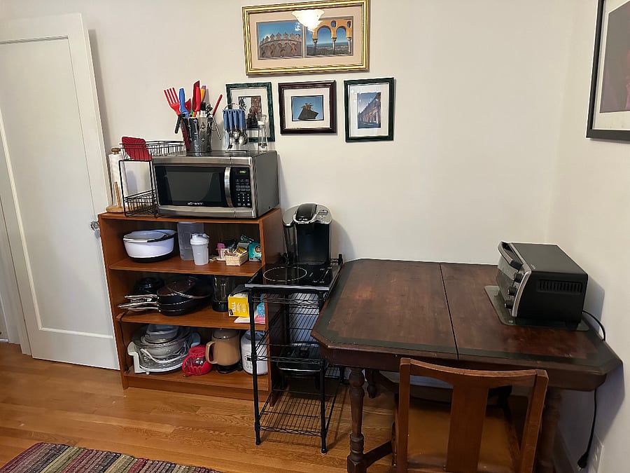 Microwave, toaster oven, induction hot plate, portable convection oven, electric skillet, electric tea kettle, rice cooker, pots, pans and prep bowls.