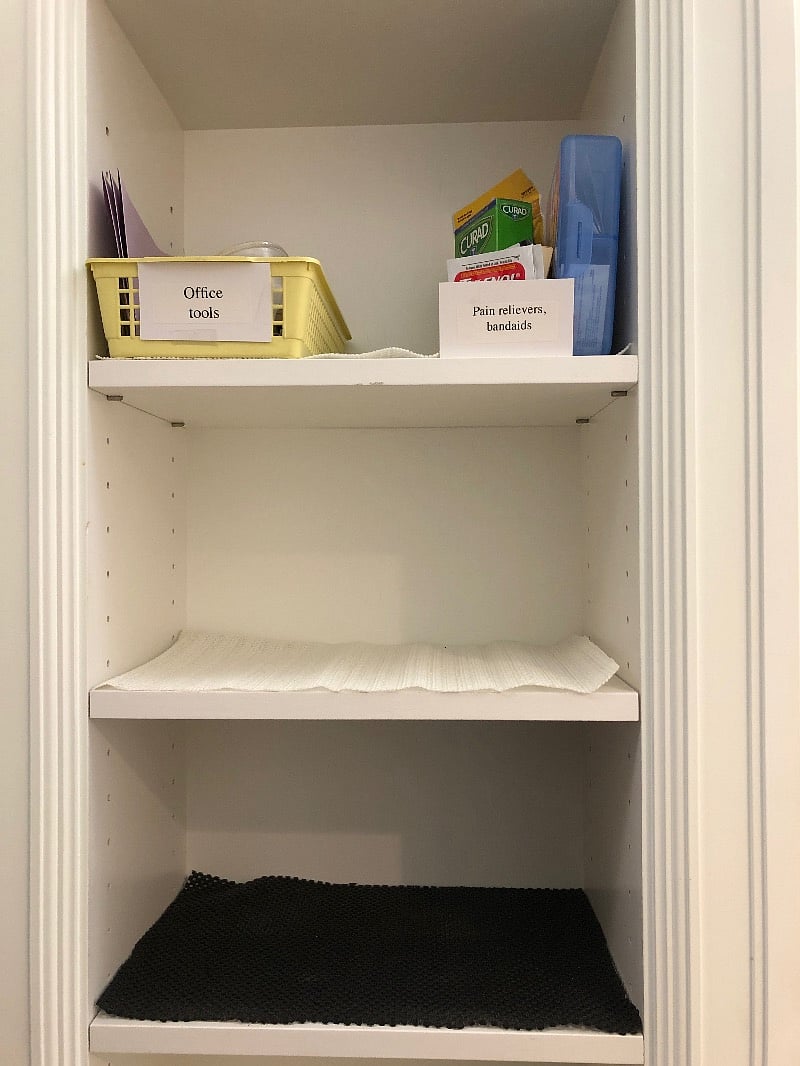 Close up of some of the built in shelves. There's more storage behind the door in a deep linen closet with 2 roll out drawers.